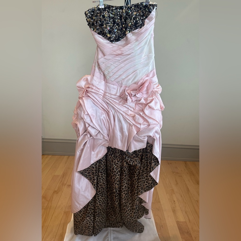 Worn once couple small dark dots on the top.